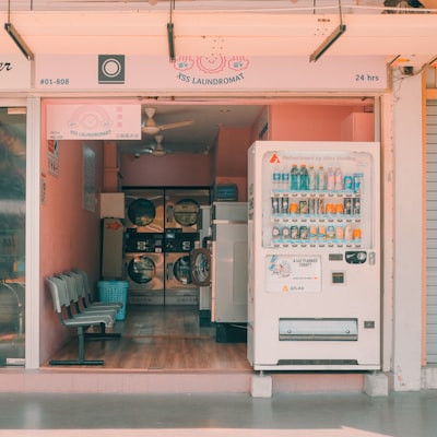 a store front with a white refrigerator